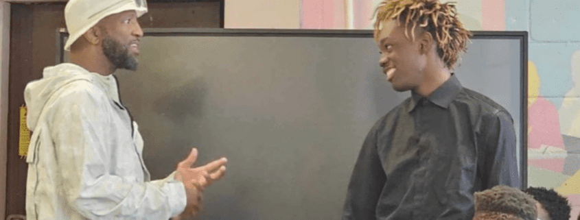 Two people having a friendly conversation indoors.